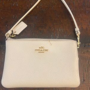 Coach wristlet. Small stain on front